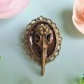 Broche steampunk tete oiseau